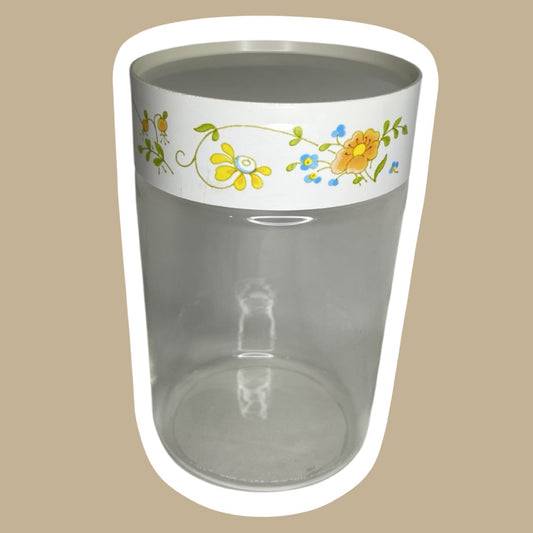 Bote de vidrio con tapa y diseño floral de la década de 1970 de Corning Pyrex con diseño de flores silvestres