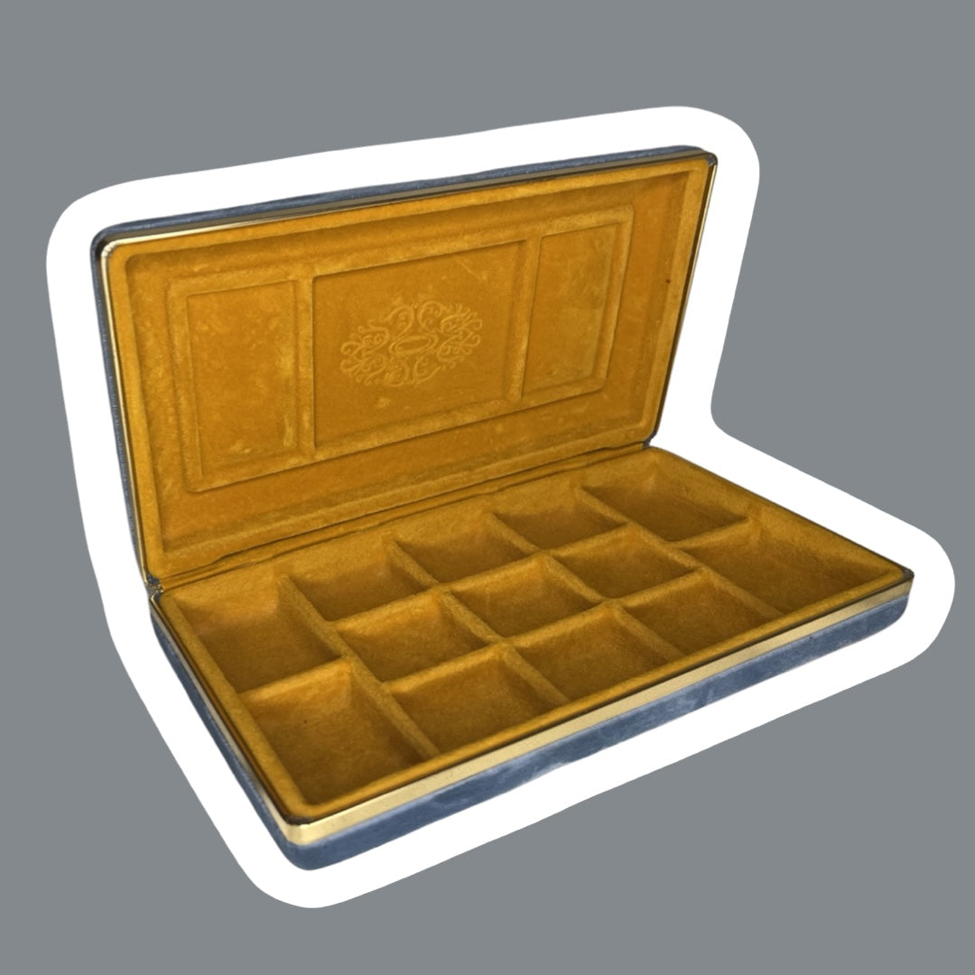 Estuche de viaje para joyas de terciopelo azul con interior dorado