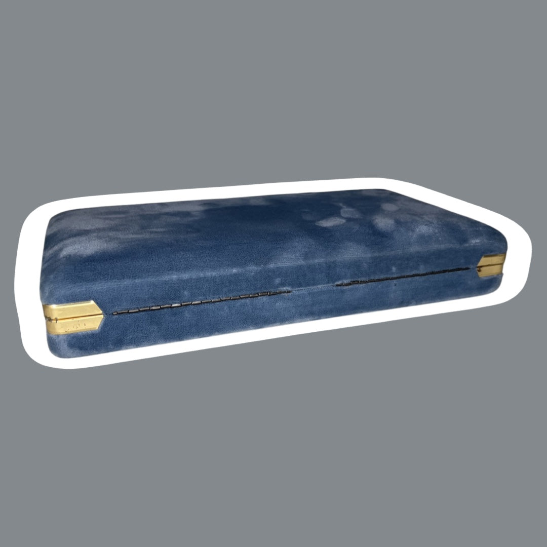 Estuche de viaje para joyas de terciopelo azul con interior dorado
